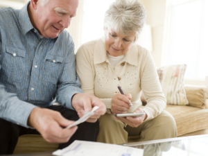 Senior couple discussing life insurance finances